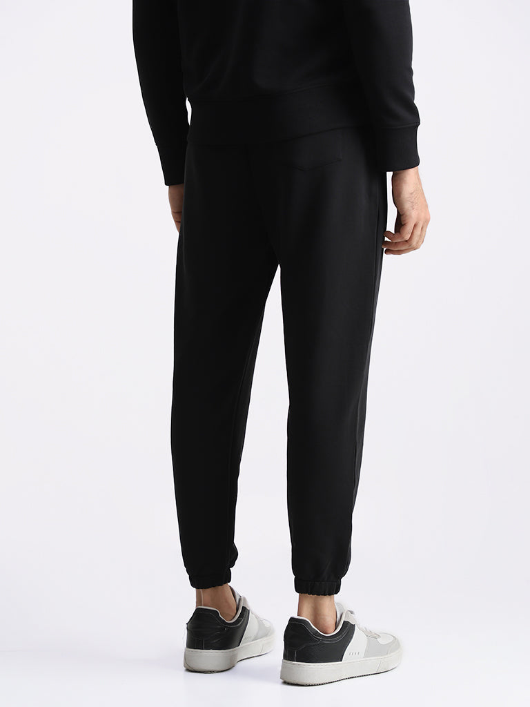WES Casuals Solid Black Relaxed Fit Trackpants
