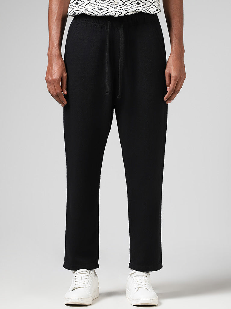 Westside ETA Men's Self Black Cotton Relaxed-Fit Low-Rise Chinos for Casual Wear Front View