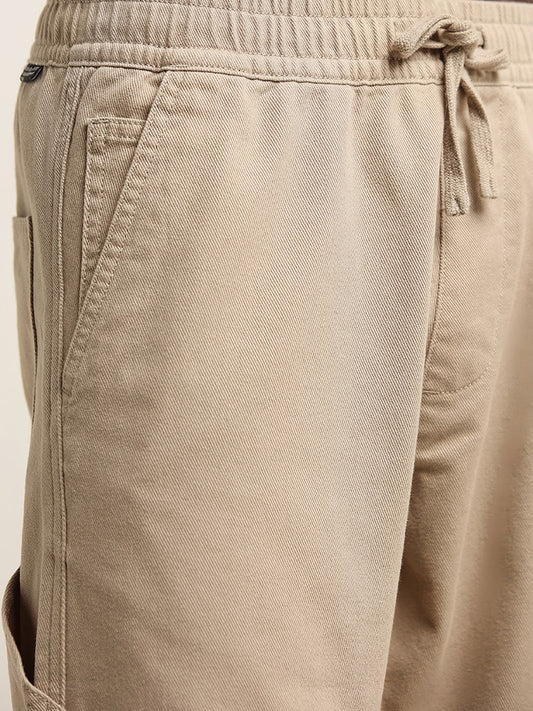 Nuon Beige Relaxed Fit Solid Cotton Mid Rise Pants