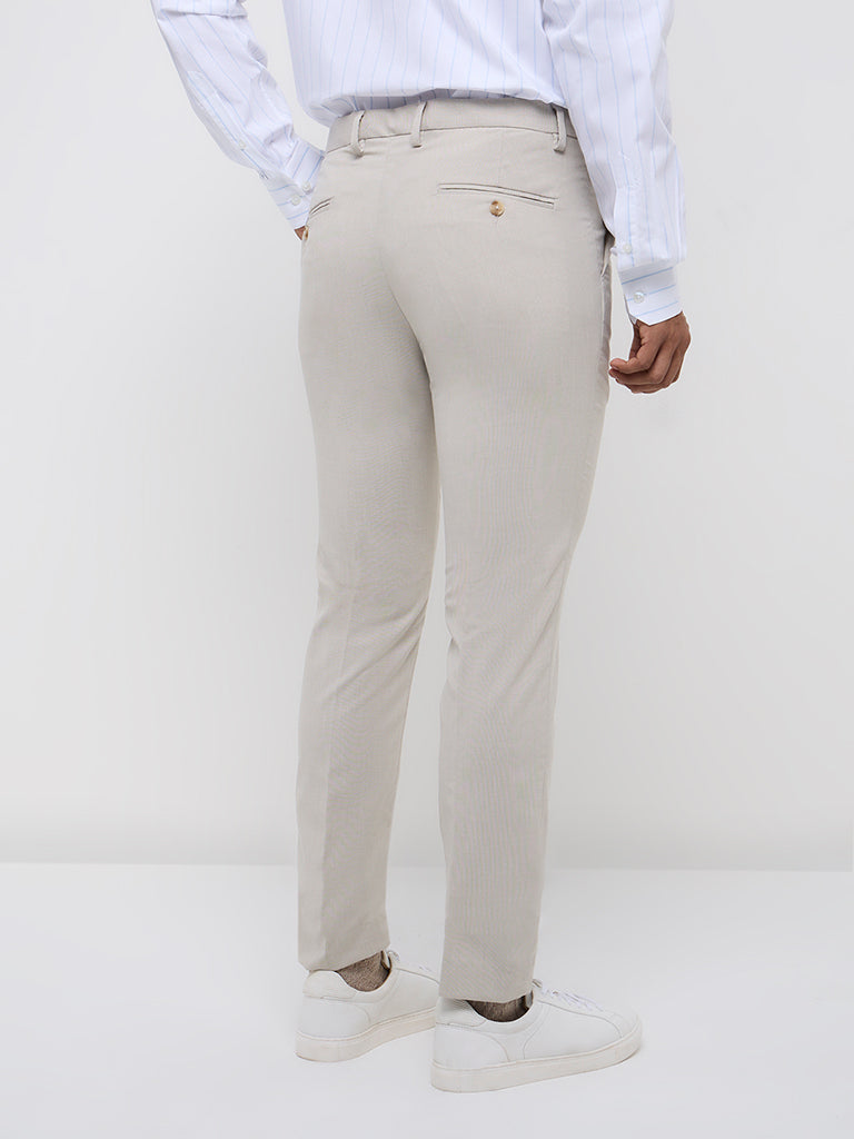 Westside WES Formals Men's Beige Solid Ultra-Slim Fit Mid-Rise Trousers for Work Wear Back View