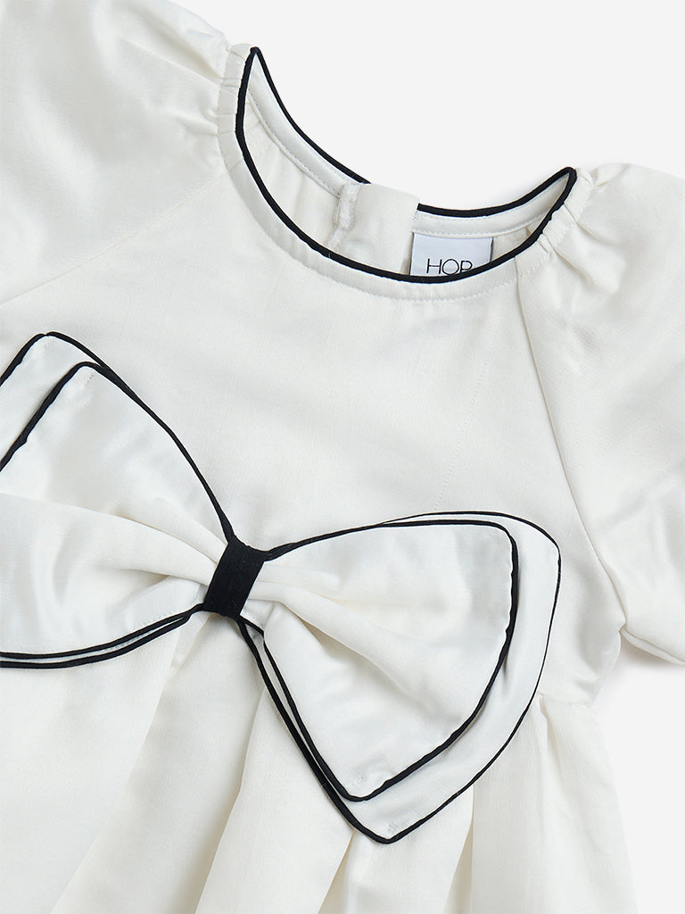 Westside HOP Kids White Bow Design Fit-and-Flare Dress for Casual Wear Zoomed View