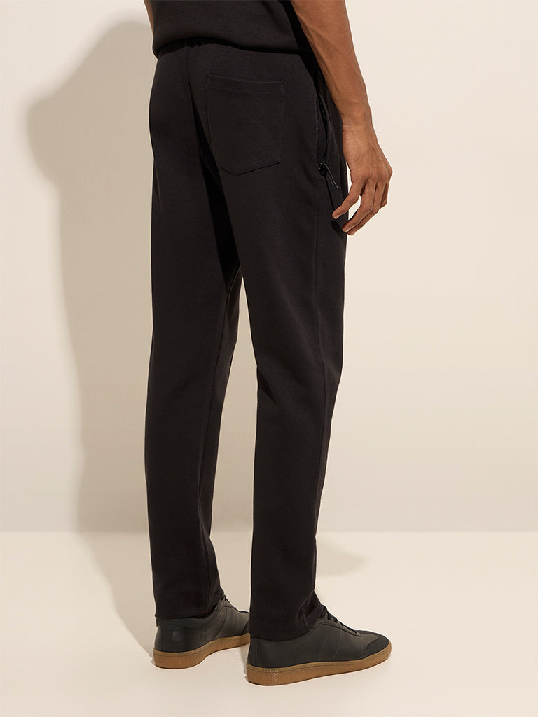 Westside Studiofit Men's Black Relaxed-Fit Mid-Rise Cotton Track Pants for Sports Wear Back View