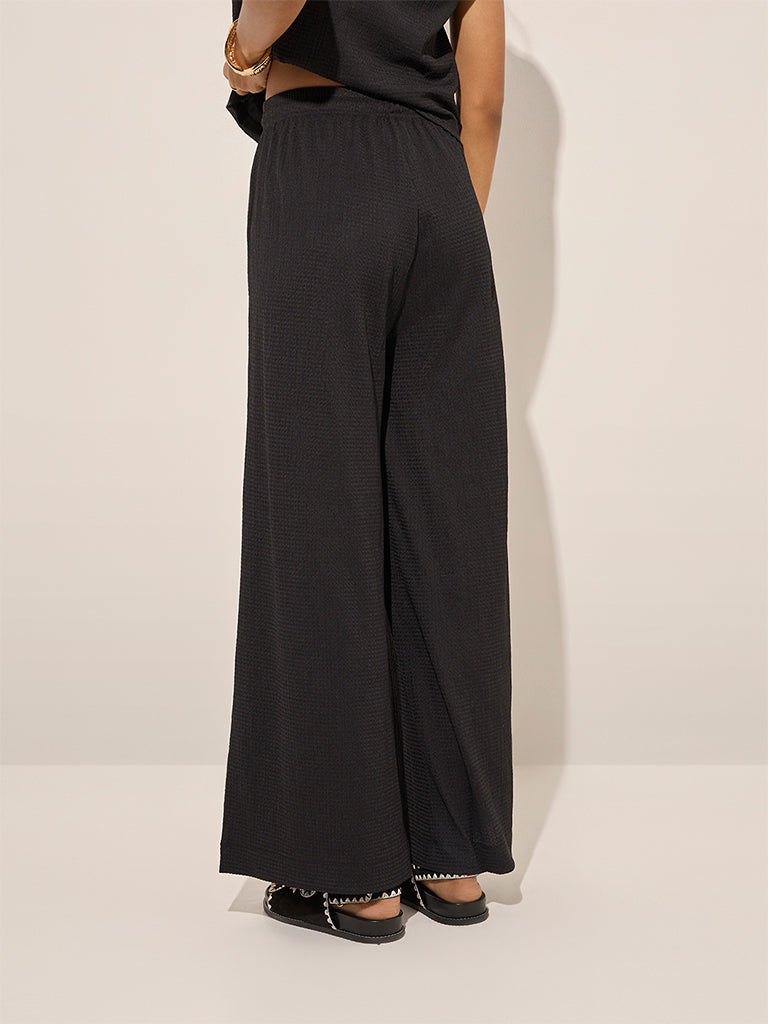 Westside LOV Women's Black Self-Textured High-Rise Trousers for Casual Wear Casual Wear Back View