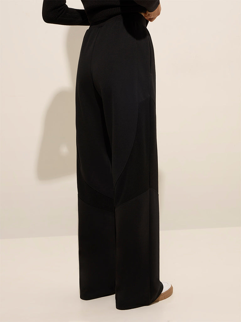 Westside Studiofit Women's Black Solid High-Rise Cotton-Blend Track Pants for Sports Wear Back View