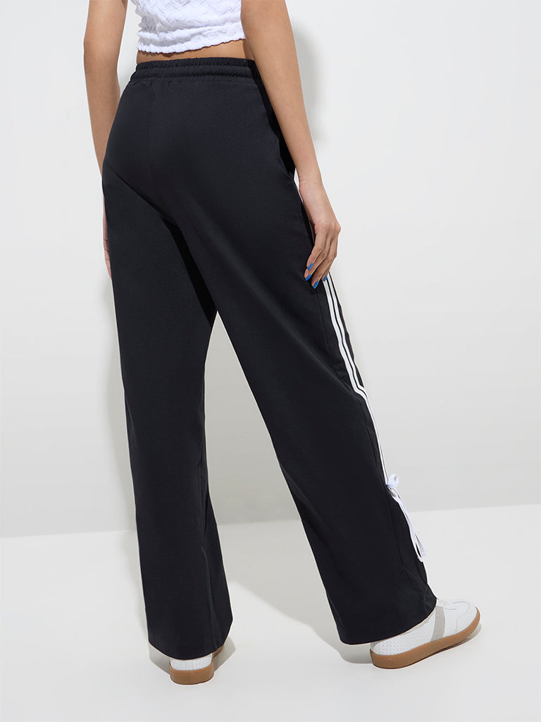 Westside Studiofit Women's Black Stripe Detailed High-Rise Cotton Track Pants for Sports Wear Back View