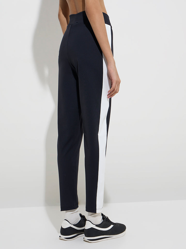 Westside Studiofit Women's Black Panel-Detailed High-Rise Track Pants for Sports Wear Back View