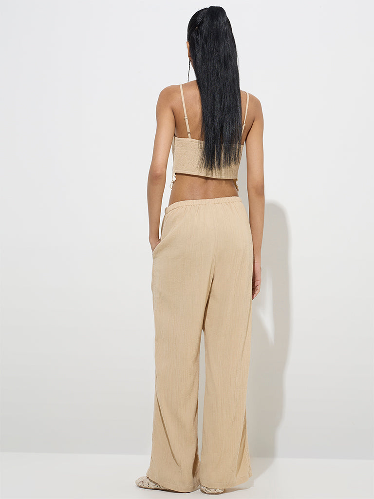 Westside Nuon Women's Beige Crinkle-Textured Mid-Rise Pants for Casual Wear Back View