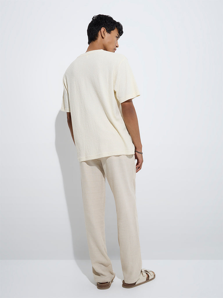 Westside ETA Men's Beige Relaxed-Fit Mid-Rise Cotton-Blend Chinos for Casual Wear Back View
