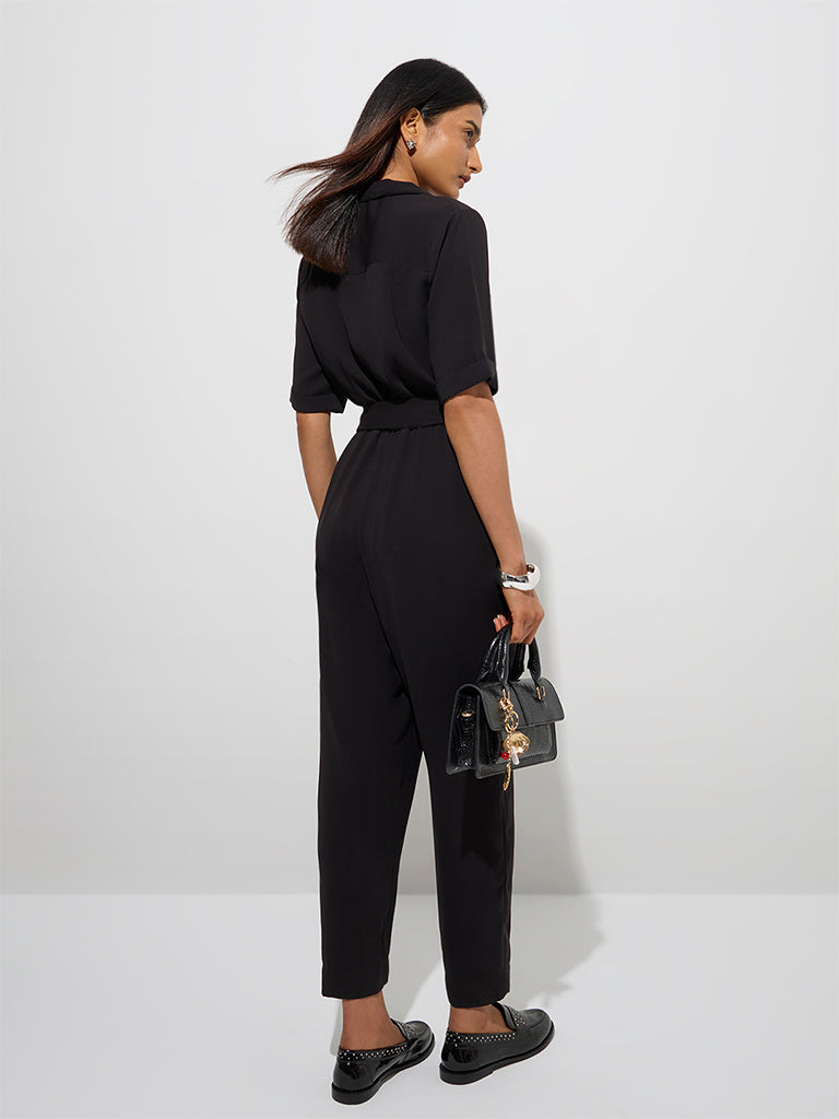 westisde Wardrobe Women's Black Solid Jumpsuit with Belt for Work Wear Back View