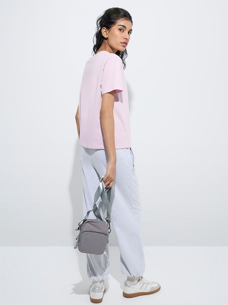 westisde Studiofit Women's Light Pink Typographic Cotton T-Shirt for Sports Wear Back View