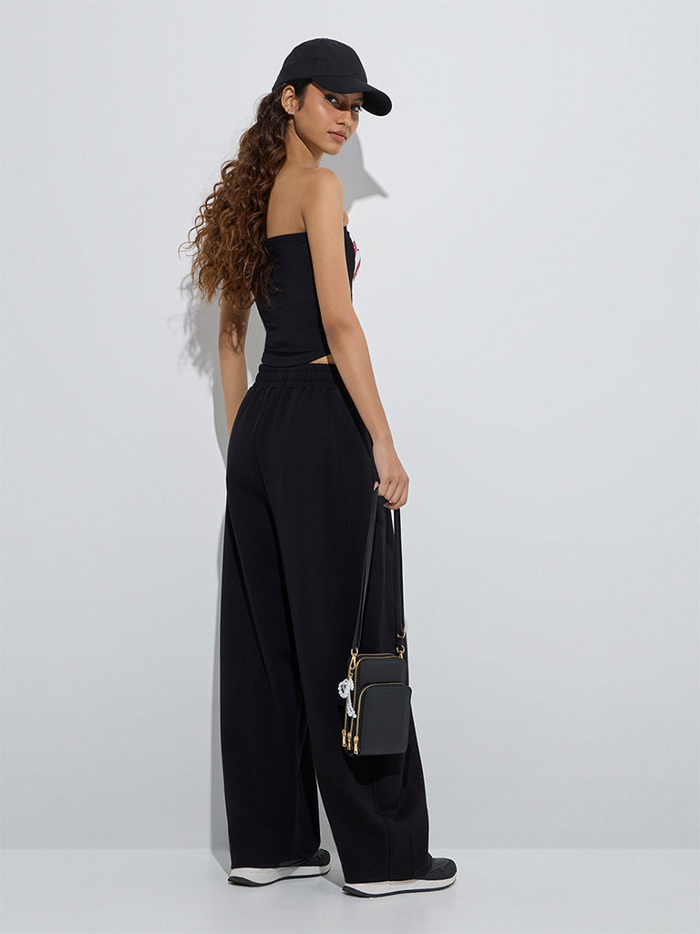 Westside Studiofit Women's Black Solid High-Rise Cotton Track Pants for Sports Wear Back View