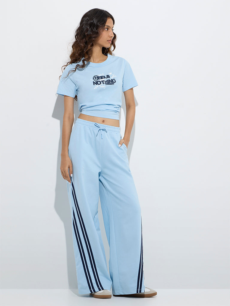 Westside Studiofit Women's Light Blue Typographic Cotton T-Shirt for Sports Wear Full Model View