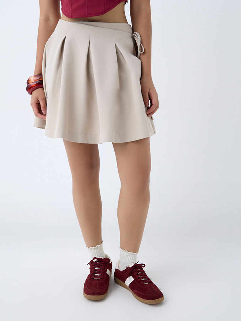 Westside Nuon Women's Beige Box Pleated High-Rise Skirt for Casual Wear Front View