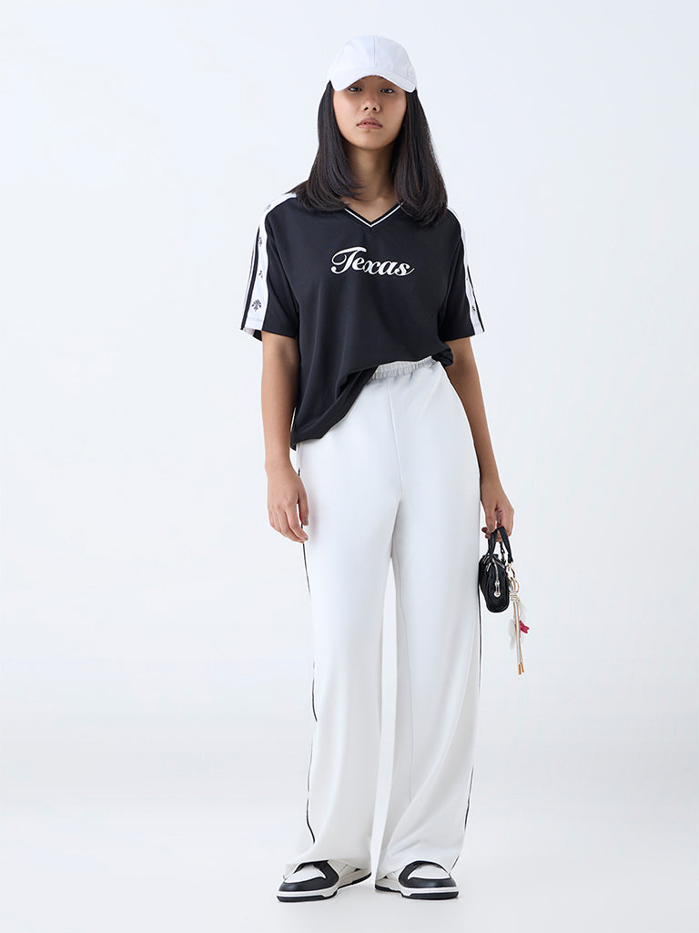 Buy Studiofit White High-Rise Track Pants from Westside
