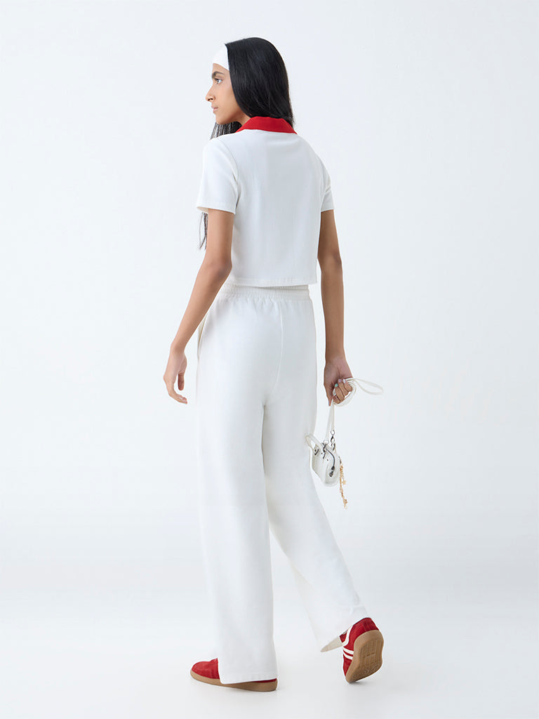 Westside Studiofit Women's White Ribbed-Textured Polo T-Shirt for Sports Wear Back View