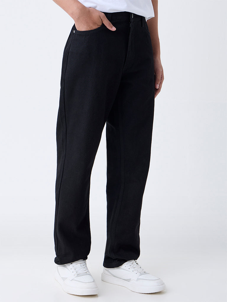 Westside Nuon Men's Black Solid Relaxed-Fit Mid-Rise Jeans for Casual Wear Front view