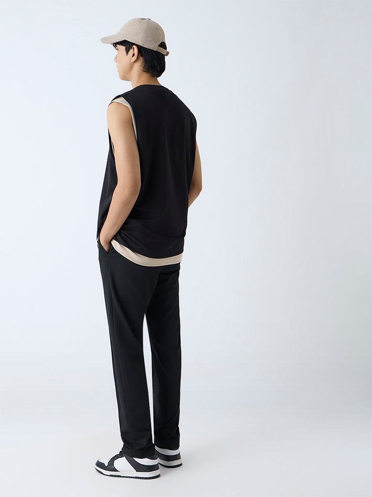 Westside Studiofit Men's Black Solid Relaxed-Fit Mid-Rise Pants for Sports Wear Back View