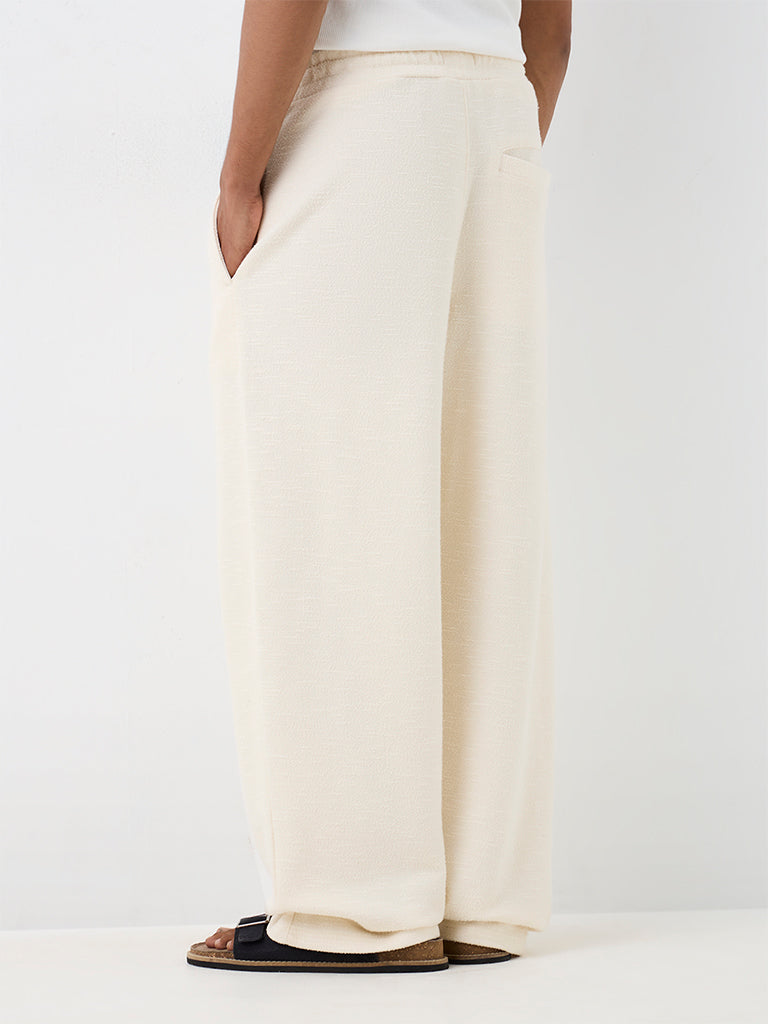 ETA Off-White Textured Relaxed-Fit Mid-Rise Cotton-Blend Chinos