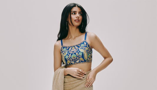 Stylish men and women in glamorous cocktail night outfits from Westside – featuring sequin sarees, gowns, and bandhgalas for a festive wedding look