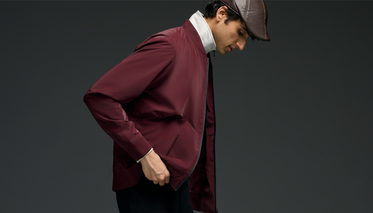 Man wearing a puffer jacket styled with hoodie, jeans and sneakers for winter