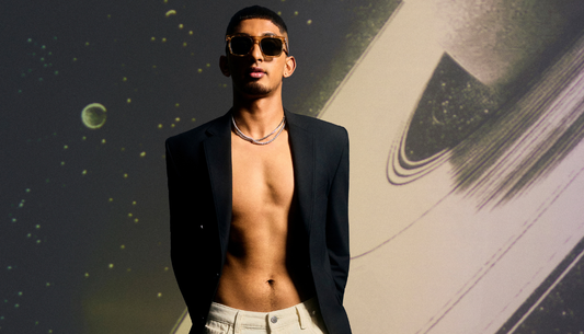 Men wearing stylish party outfits with blazers, shirts and statement shoes