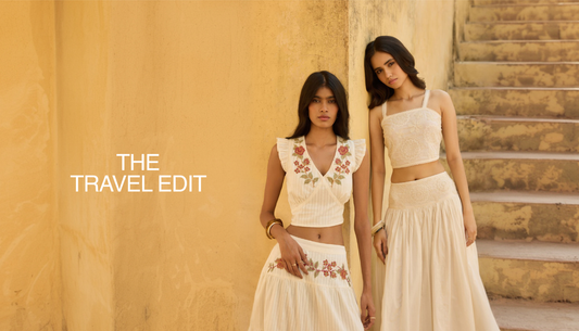 Woman styling lightweight summer travel outfits with dresses, tops, and accessories from Westside