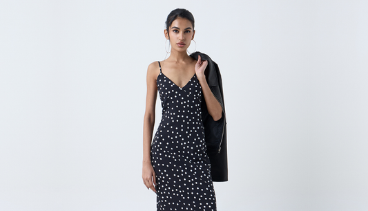Model wearing a modern polka dot outfit styled for the season
