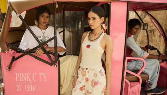Models styling yellow summer outfits and bright home décor accents from Westside