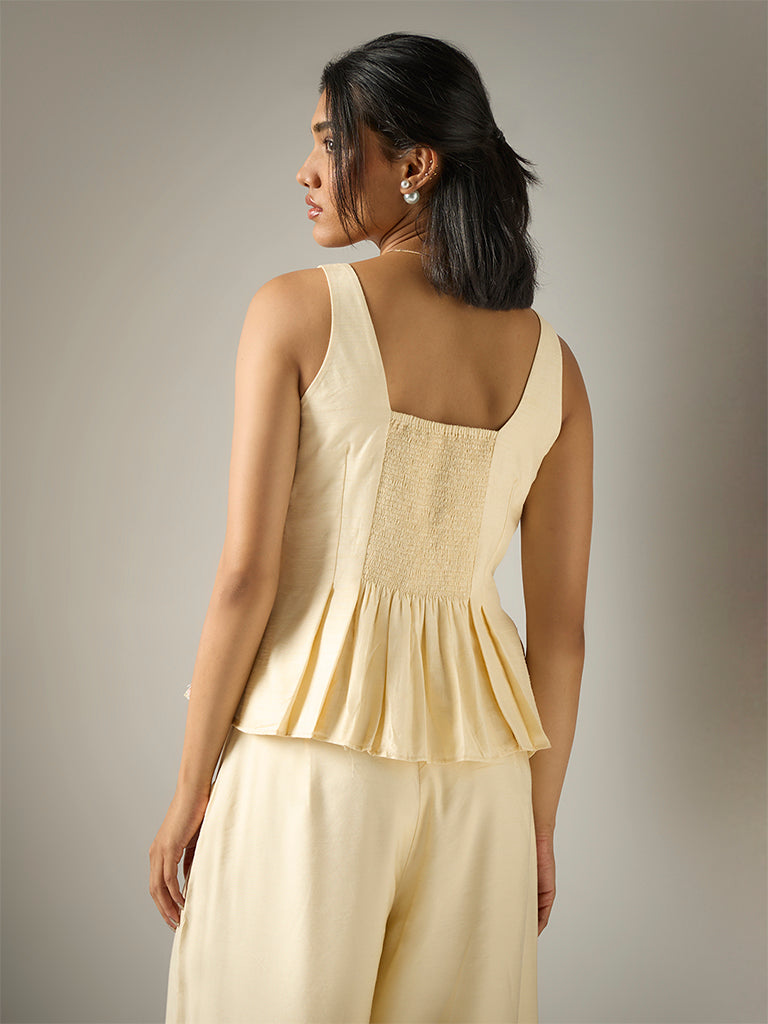 Embroidered Peplum Top – Cream