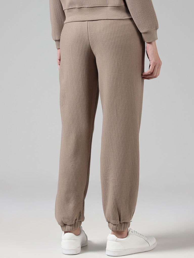 Buy Studiofit Beige Ribbed High Waisted Joggers from Westside