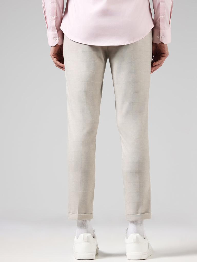WES Formals Solid Beige Carrot Fit Trousers