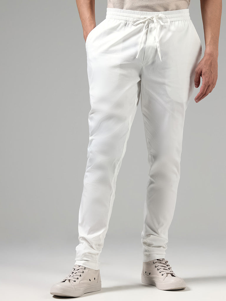 White Churidar Pants In Cotton Lycra Design by Dev R Nil Men at Pernia's  Pop Up Shop 2024