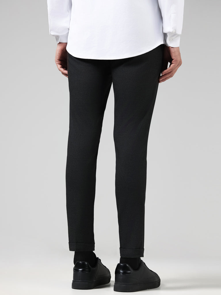 WES Formals Solid Charcoal Carrot Fit Trousers