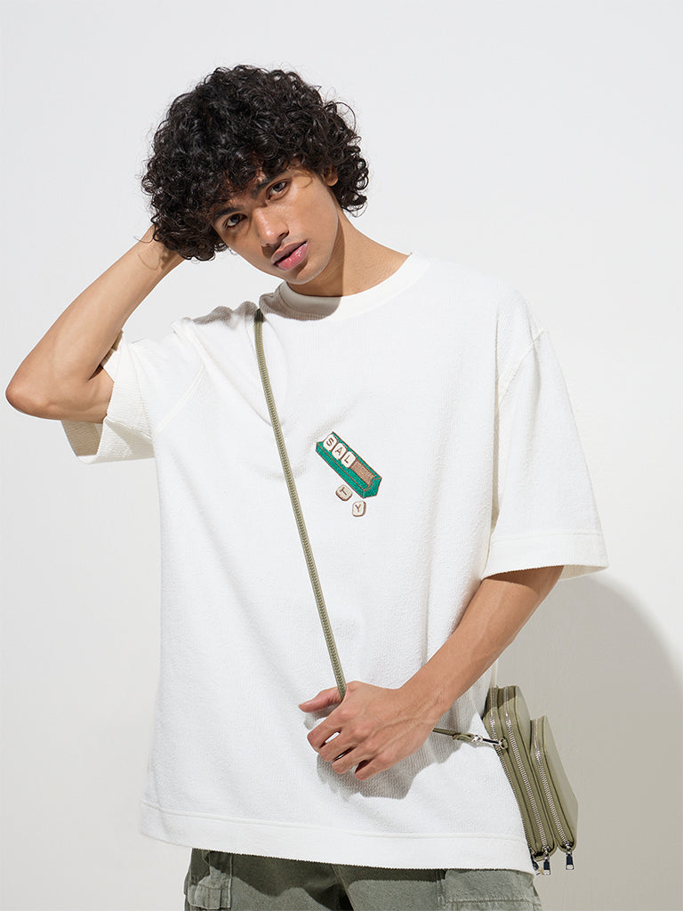 westisde Nuon Men's White Typographic Relaxed-Fit Cotton T-Shirt for Casual Wear Full Model View