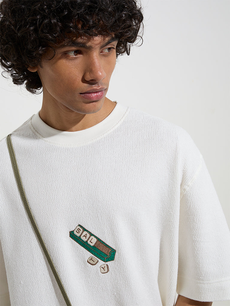 westisde Nuon Men's White Typographic Relaxed-Fit Cotton T-Shirt for Casual Wear Zoom View