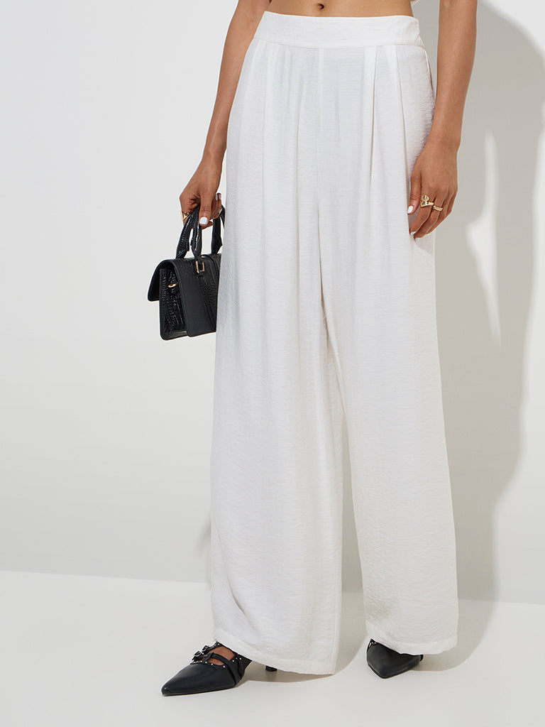 Wardrobe Ivory Crinkle-Textured Flared Mid-Rise Pants