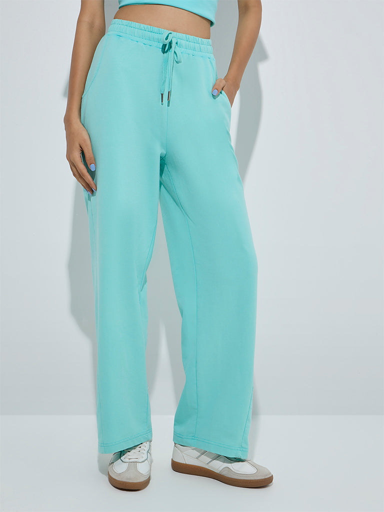westisde Studiofit Women's Aqua Solid High-Rise Cotton Track Pants for Sports Wear Front View