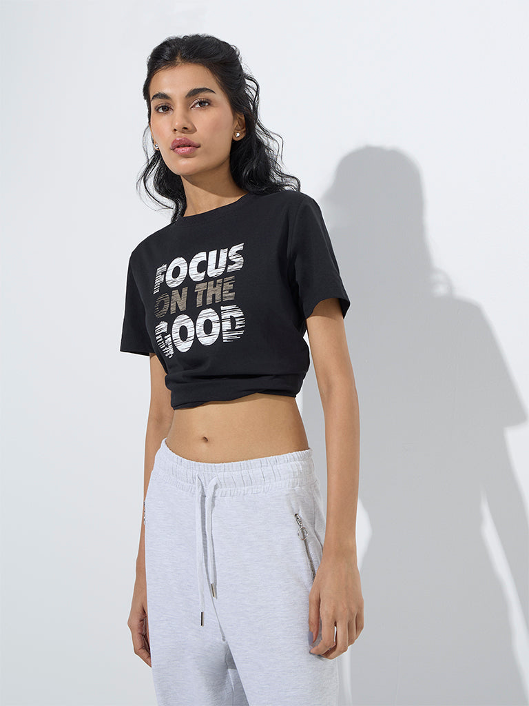 westisde Studiofit Women's Black Text Printed Cotton T-Shirt for Sports Wear Front View