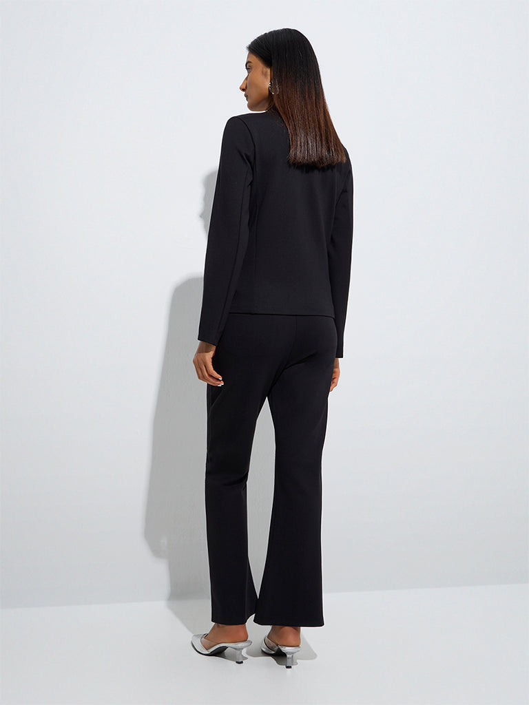 Westside Wardrobe Women's Black Flared High-Rise Trousers for Work Wear Back View