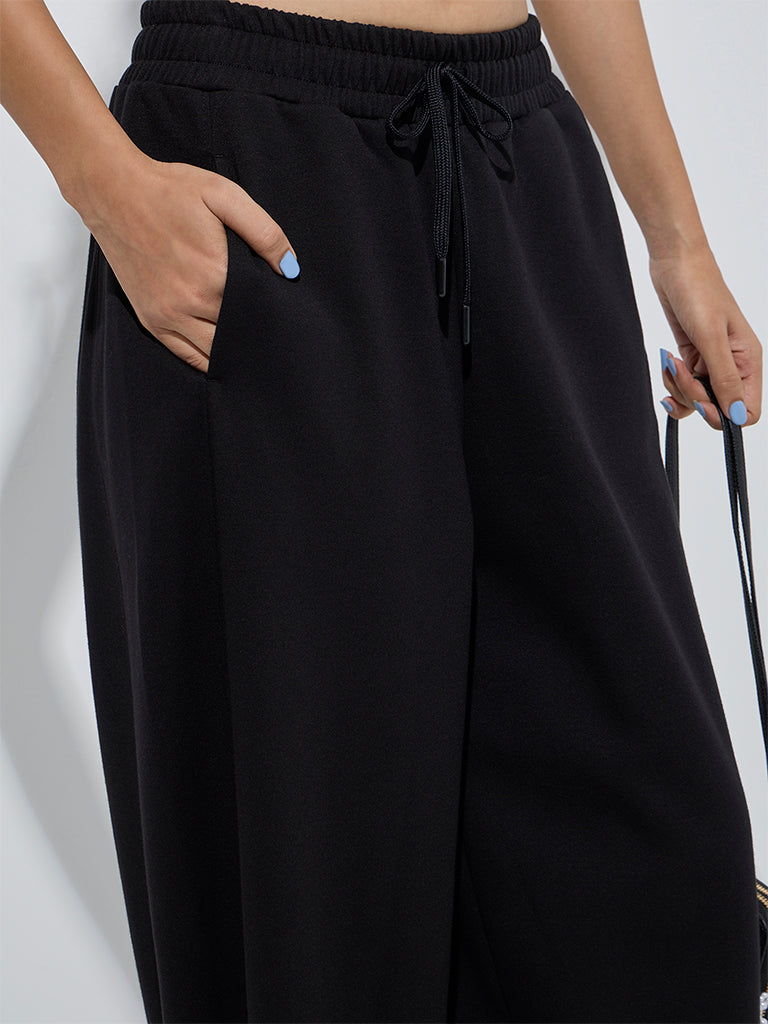 Westside Studiofit Women's Black Solid High-Rise Cotton Track Pants for Sports Wear Zoom View