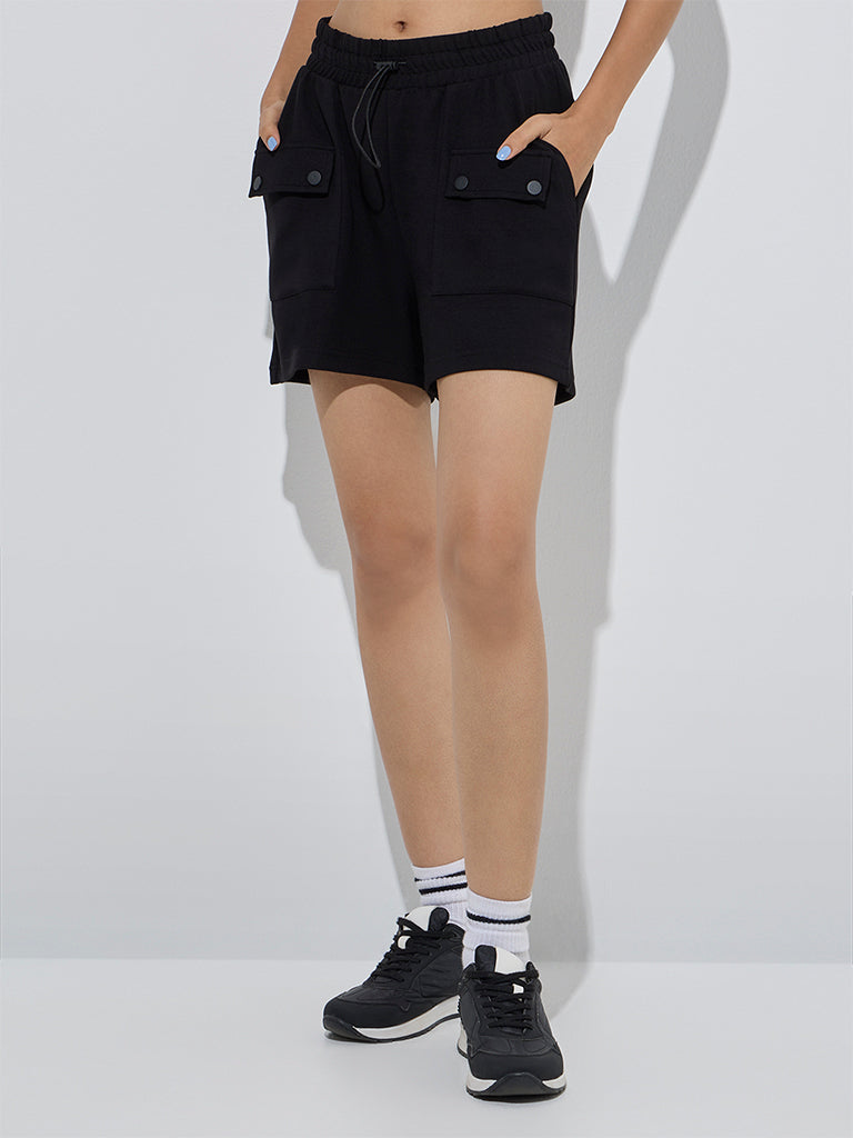 Westside Studiofit Women's Black Solid High-Rise Shorts for Sports Wear Front View