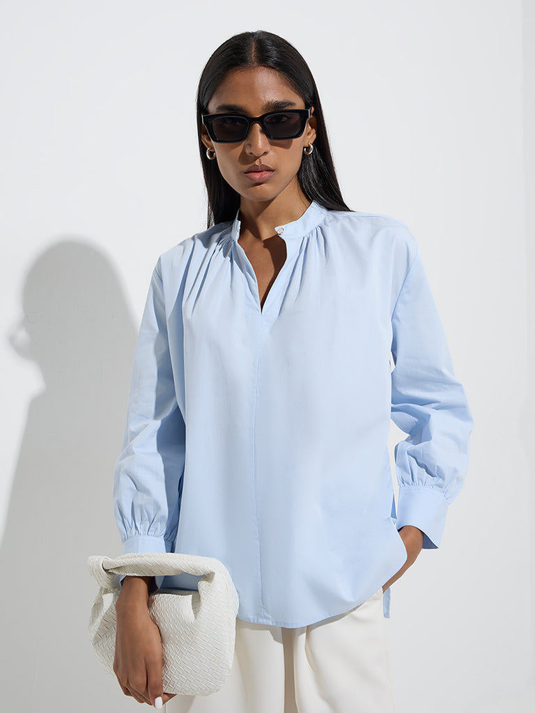 Westside Wardrobe Women's Light Blue Solid Blouse for Work Wear Front View