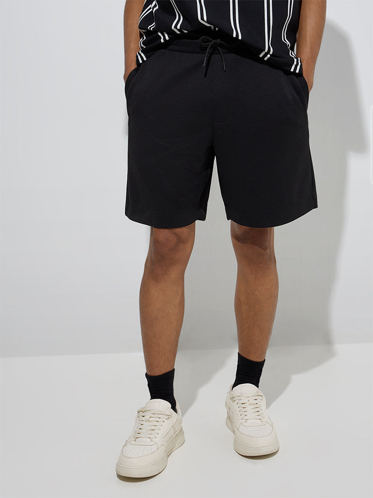 Westside Studiofit Men's Black Solid Relaxed-Fit Mid-Rise Shorts for Sports Wear Front View