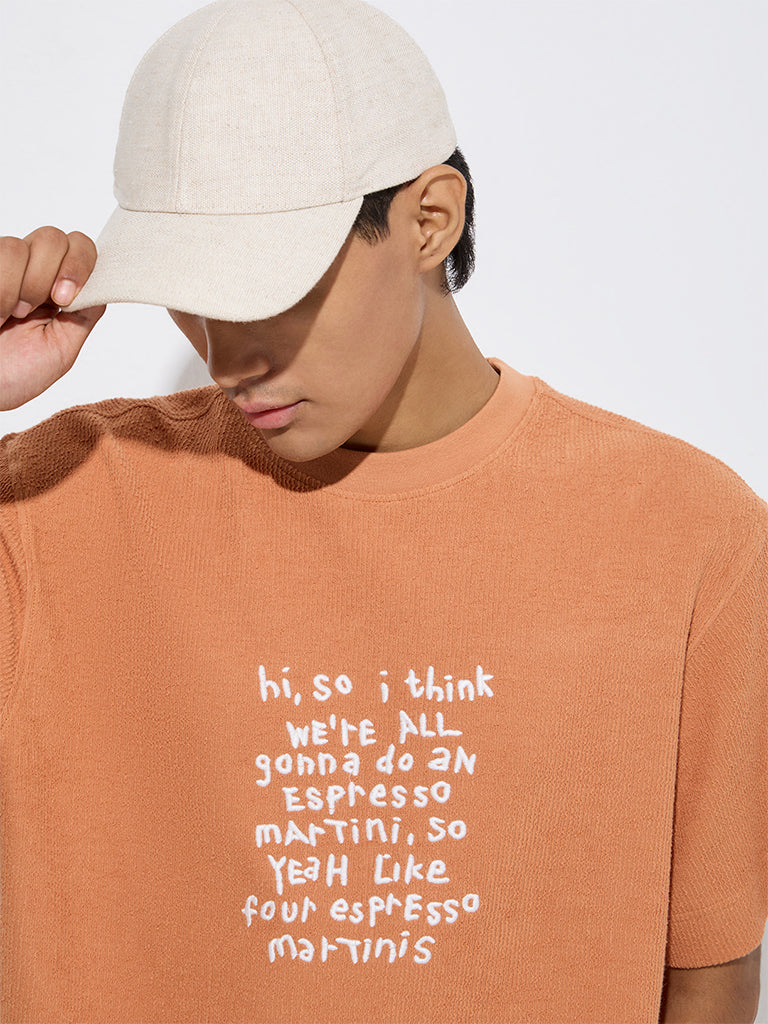 Westside Nuon Men's Orange Text Pattern Relaxed-Fit Cotton T-Shirt for Casual Wear Zoomed View