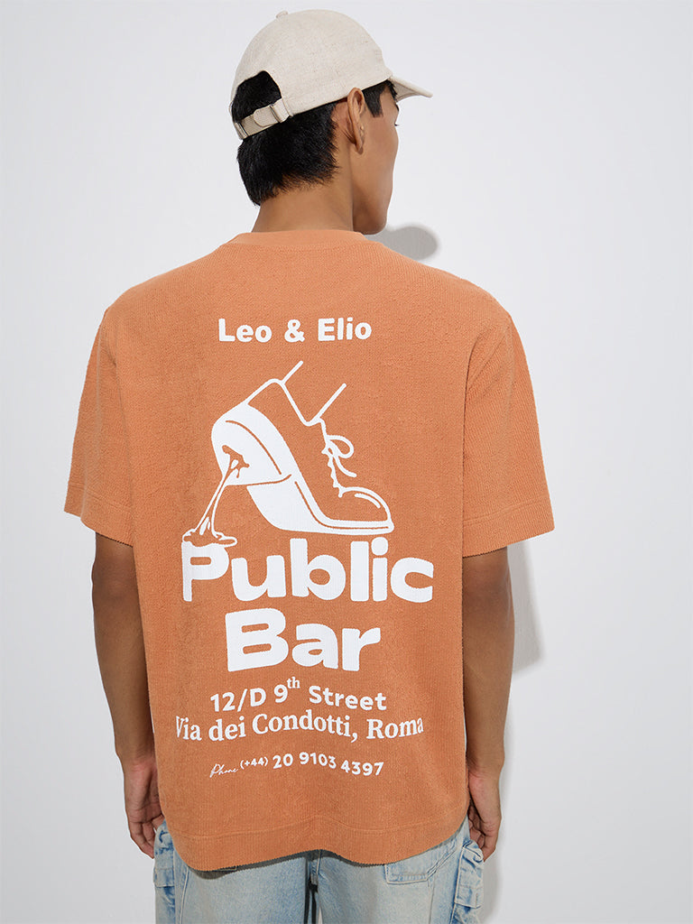 Westside Nuon Men's Orange Text Pattern Relaxed-Fit Cotton T-Shirt for Casual Wear Back View