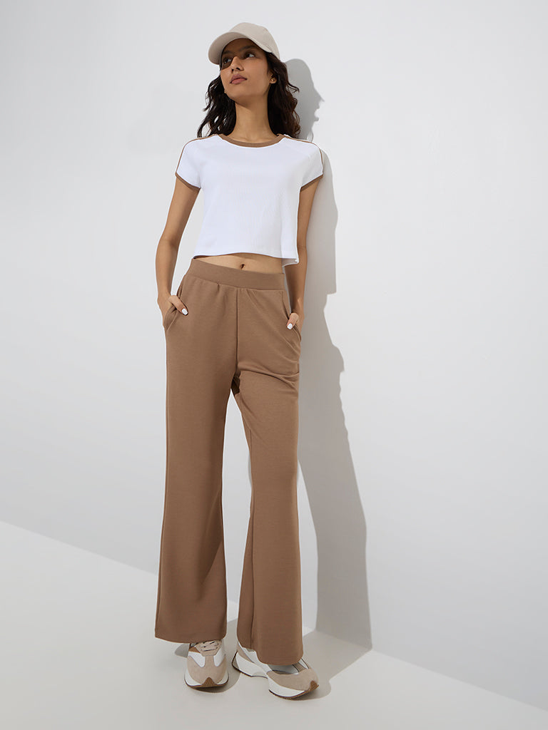 Westside Studiofit Women's Brown Cotton-Blend Flared Pants for Sports Wear Full Model View