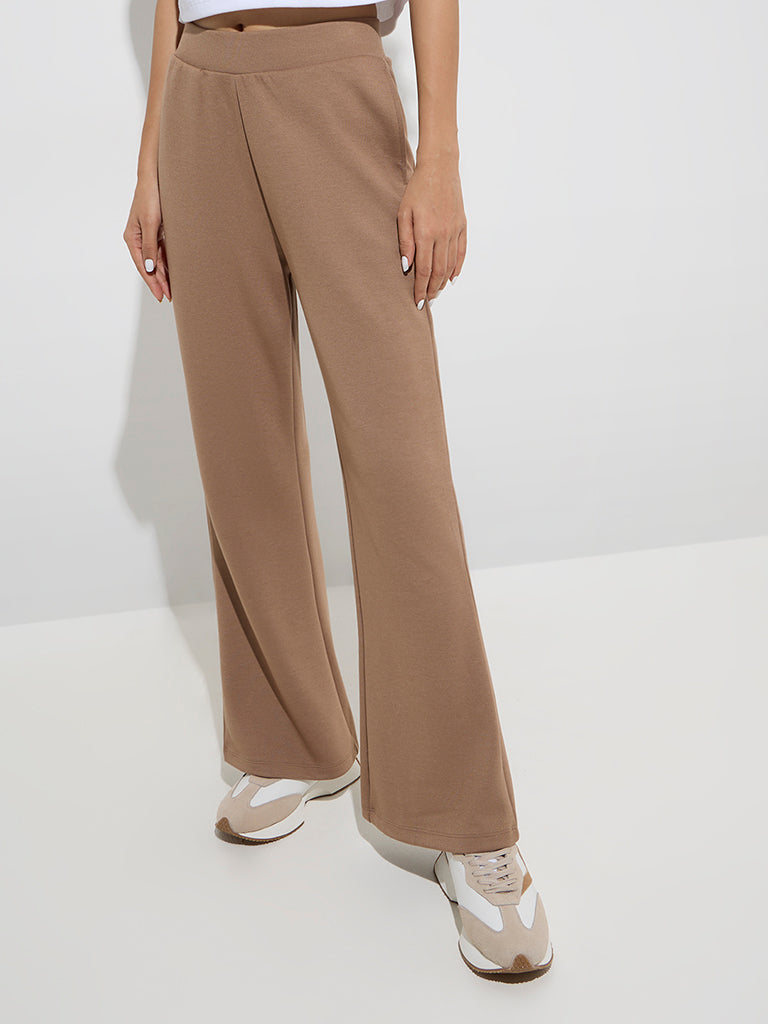 Westside Studiofit Women's Brown Cotton-Blend Flared Pants for Sports Wear Front View