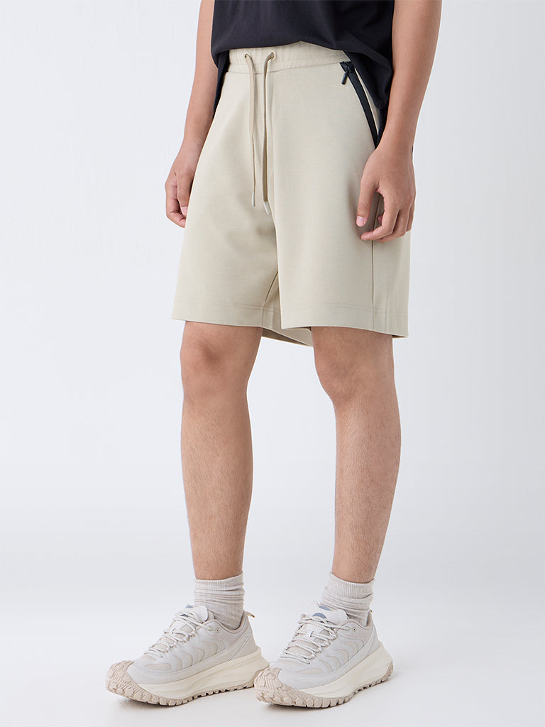 Westside Studiofit Men's Beige Solid Relaxed-Fit Mid-Rise Shorts for Sports Wear Front view