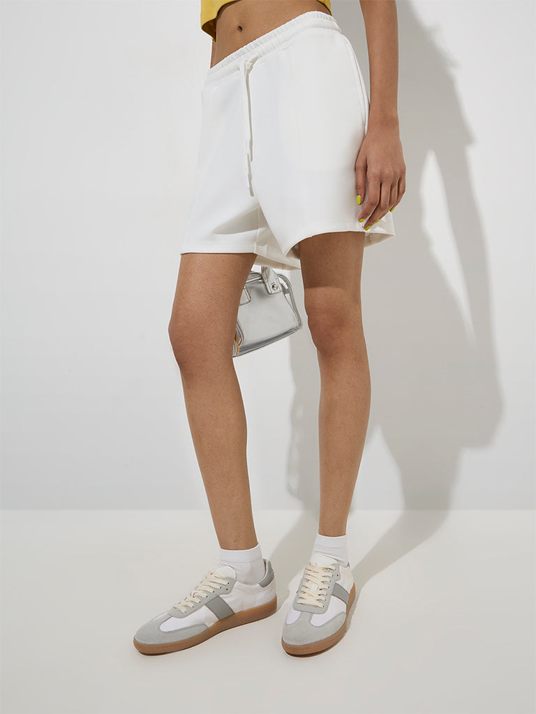 Westside Studiofit Women's White Solid Mid-Rise Shorts for Sports Wear Front View