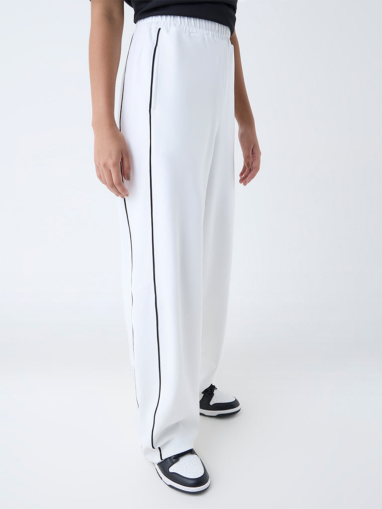 Westside Studiofit Women's White High-Rise Track Pants for Casual Wear Front View